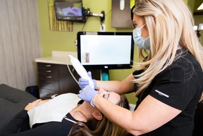 patient getting her teeth whitened at Edgewater Dental Arts