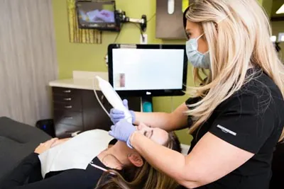 patient getting her teeth whitened at Edgewater Dental Arts