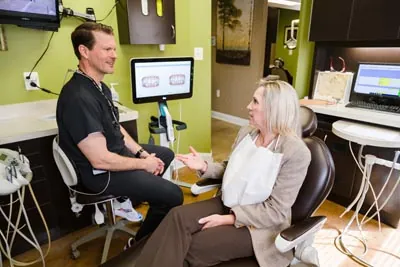 Dr. Cutting discussing treatment options with a new patient at Edgewater Dental Arts
